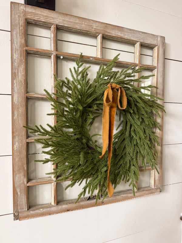 old window with wreath