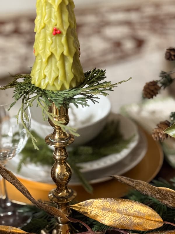 Brass candlestick with Christmas tree candle.