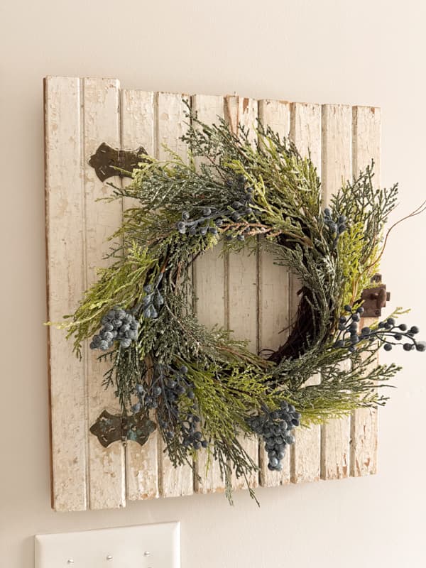 vintage cabinet door as art with wreath