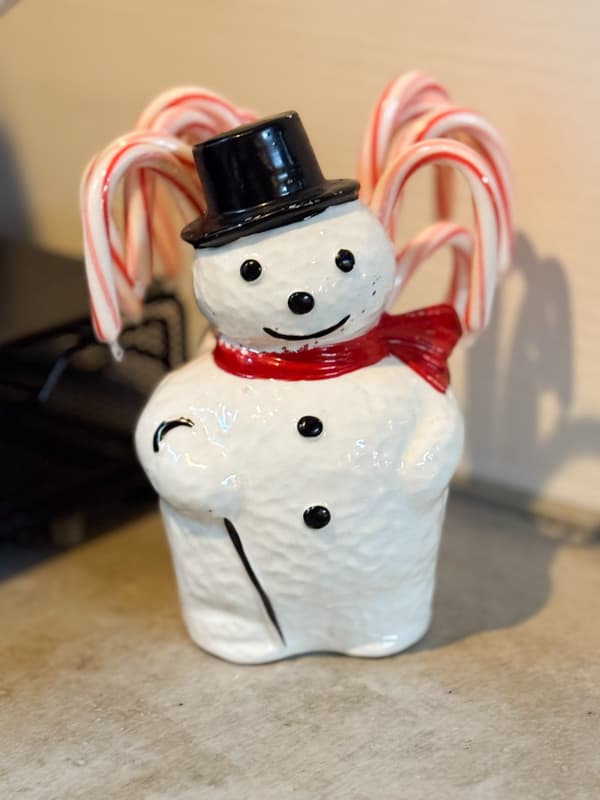 Vintage Snowman Planter with candy canes.