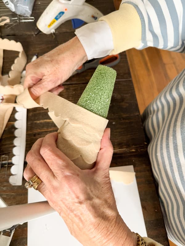 Wrap the scalloped Strips around the cone.