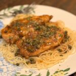 Chicken Piccats on plate with angel hair pasta