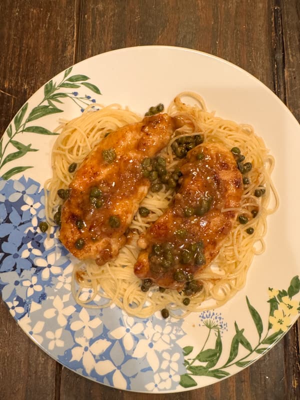 Chicken piccata sauce on plate with chicken