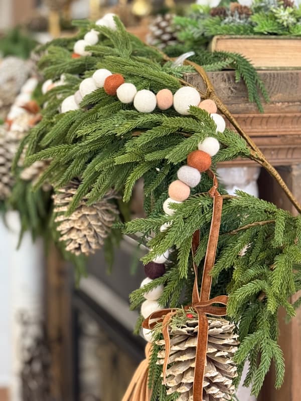 DIY felt ball garland with tassel on mantel