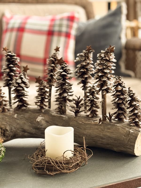 DIY Pinecone Tree centerpiece and candle with grapevine on coffee table