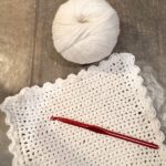 Finished crochet dishcloth with scalloped edge