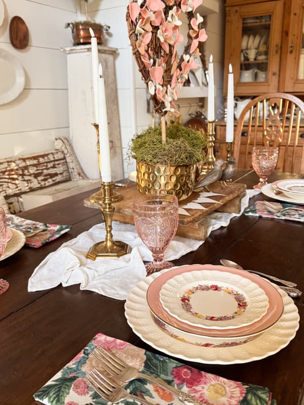 Floral napkin, Pink and floral vintage dishes with brass heart topiaries  for Valentine's Day Tablescape