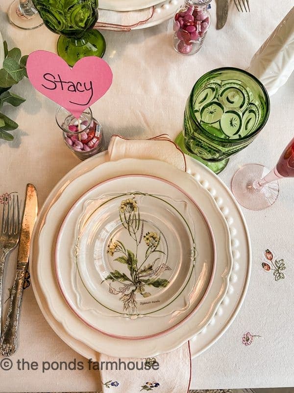 Galentine's Table Place Setting with thrifted dishes and green glassware