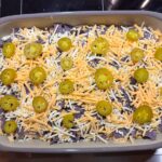 Mexican Chicken Casserole Ready for oven with jalepenos and cheese on top