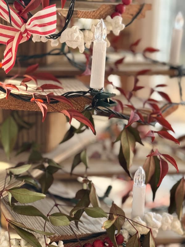 shiplap tree with clip on candles and nandina branches for winter decor