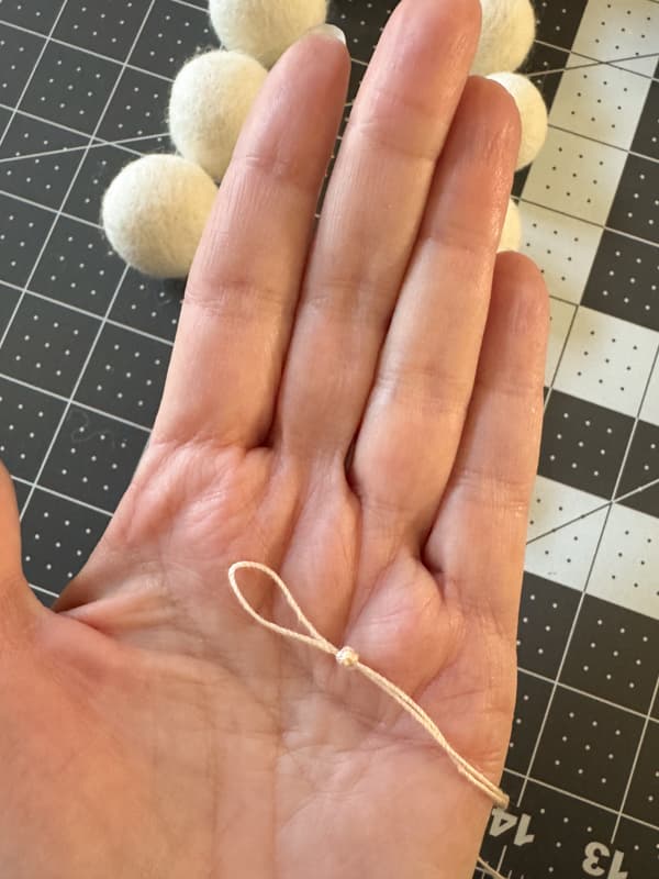 Tie of end of cord for DIY Felt Ball Garland