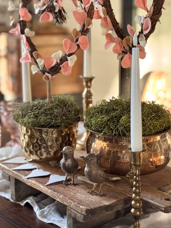DIY felt heart topiaries in vintage brass containers as table centerpiece