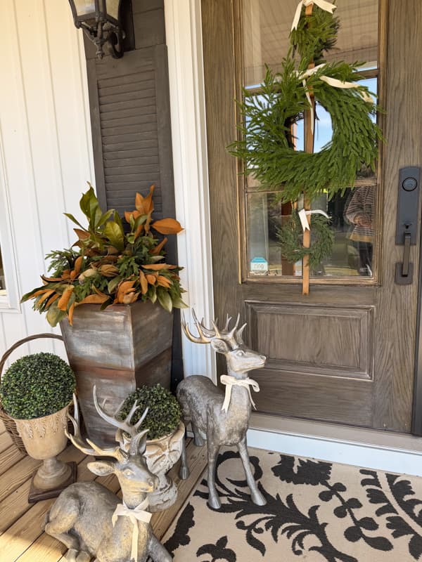 Front Porch Winter decor with deers and Greenery
