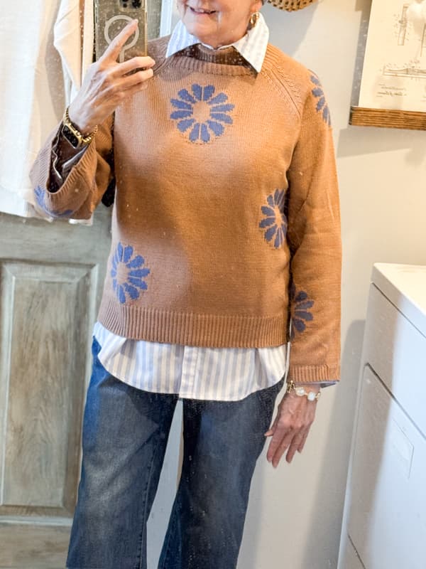 brown and blue sweater with jeans