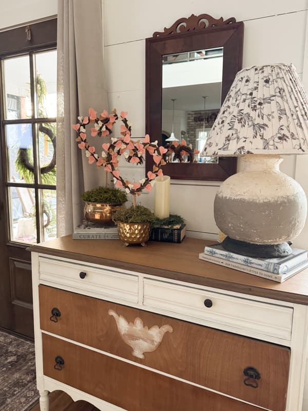 Heart Topiaries in brass containers on entry table with earthenware DIY Lamp