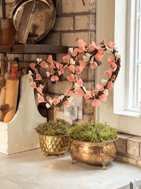 DIY Felt Topiaries in brass containers on kitchen countertop