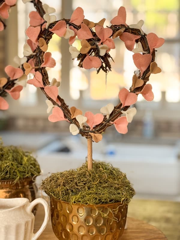 felt heart topiary in brass container on kitchen island