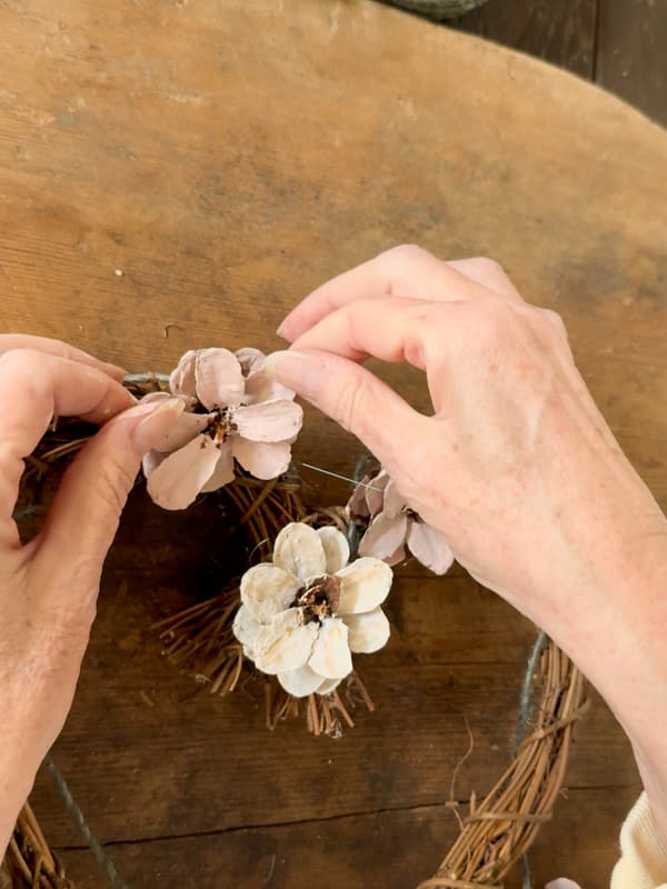 fill the heart wreath frame with pinecone flowers for a Valentine's Day Wreath