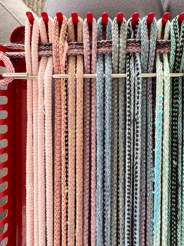 run hook over and under the fabric loops and hook another loop to weave