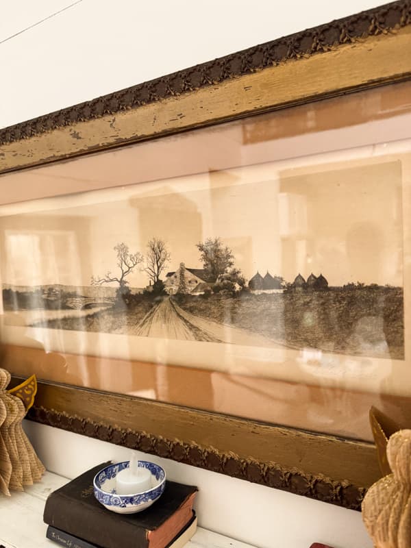 Antique etching in antique frame - thrifted find that creates a curated Modern heritage style.  