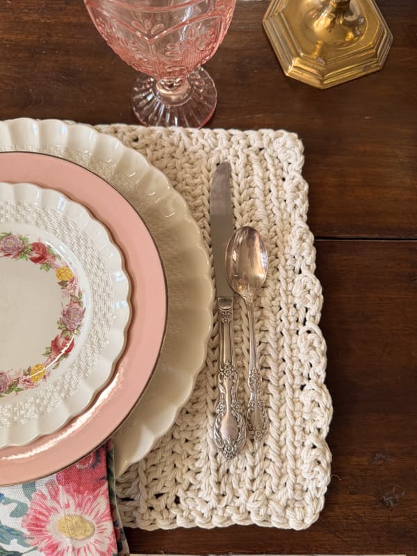 Crochet Placemat close up with silverware and vintage dishes