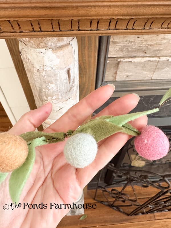 Felt flower added between the gaps on the Spring garland