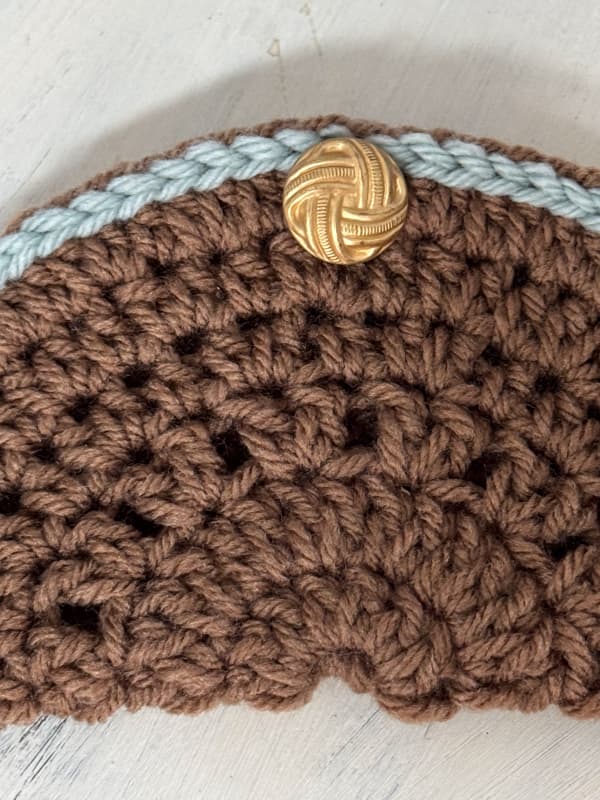 Finished blue and brown eyeglass holder with vintage button.  