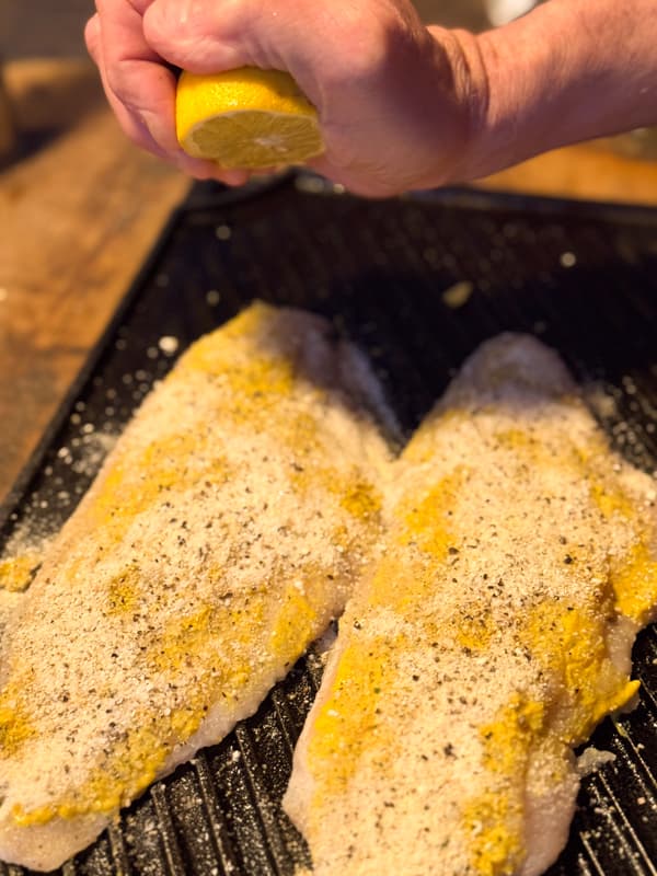 Squeeze lemon juice on mustard coated catfish oven cast iron recipe