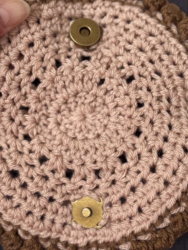 attach magnetic snaps with yarn across of each other to attach the glasses case together