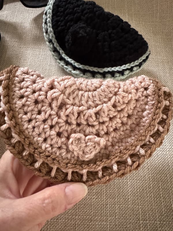 Blush and brown sunglass holder with crocheted heart embellishment