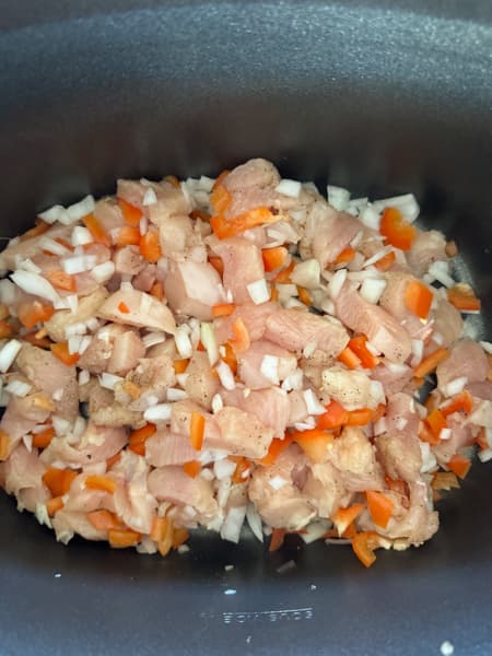 chicken, onion, and red pepper in crockpot