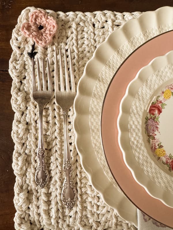 crochet blush flower to enhance the placemat and match the pink in the dishes.