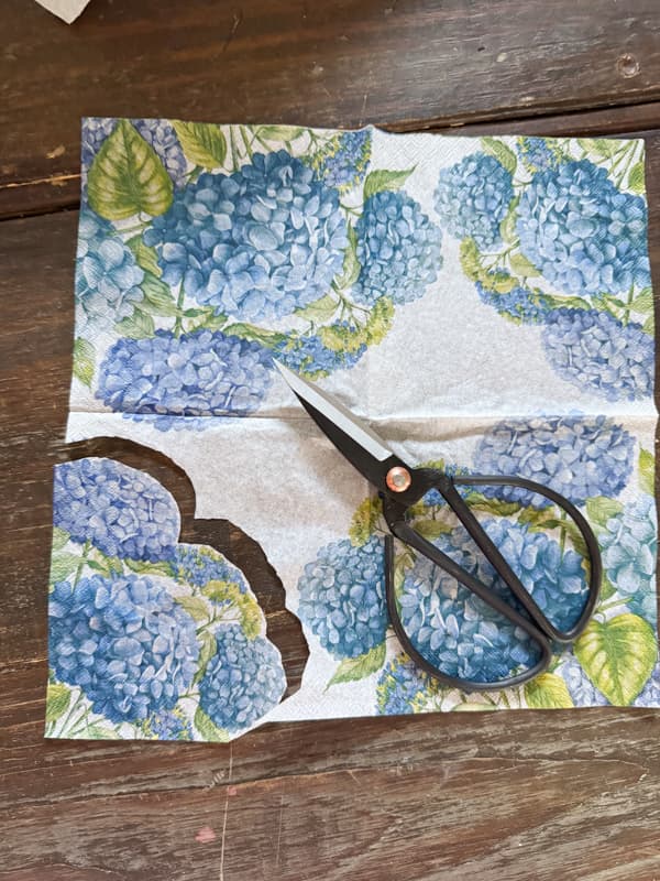 cut the napkin design to us on the silver tray napkin decoupage makeover
