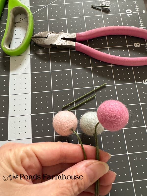 wood felt balls on floral wire stems to make flower garland