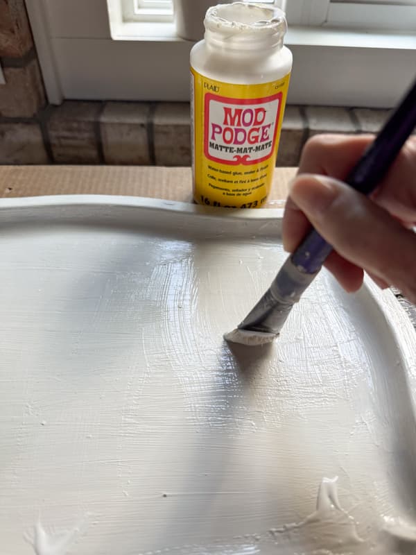 painting thrifted tray with mod podge 
