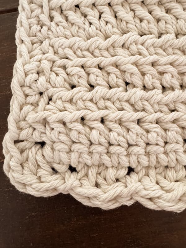 scallop stitch around the edge of the crochet placemat