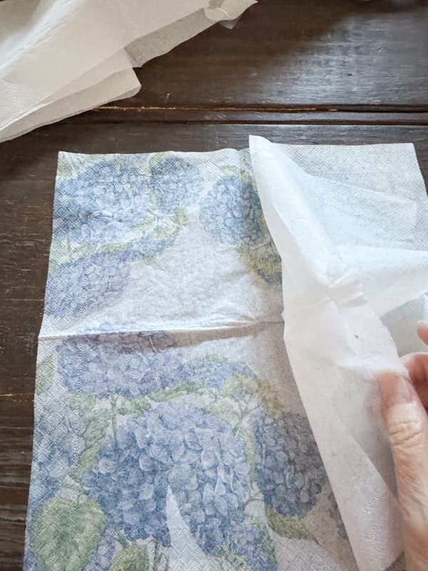 Separate the layers of the decorative napkin to use for silver tray makeover