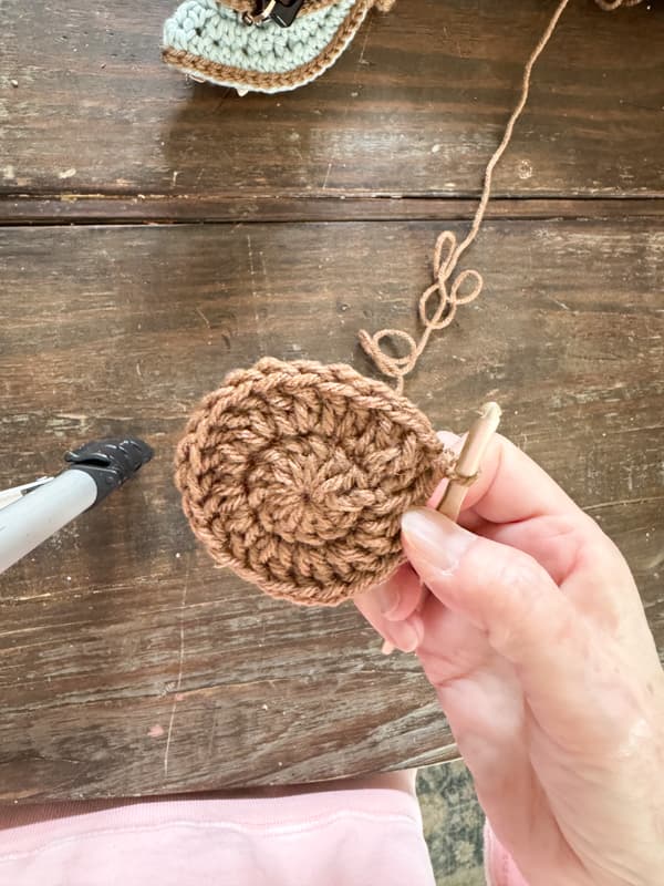 Row two 2 double crochets in each stitch and slip stitch to connect