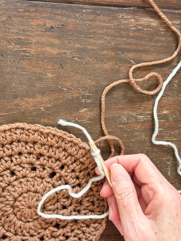 tighten ends and attach hook to new color of yarn
