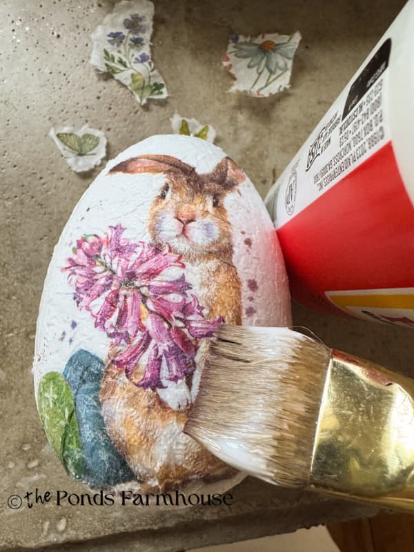 Apply bunny napkin to Styrofoam egg with mod podge