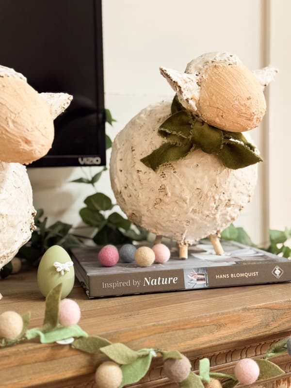 Textured Fat Lamb with green bow on Easter Mantel