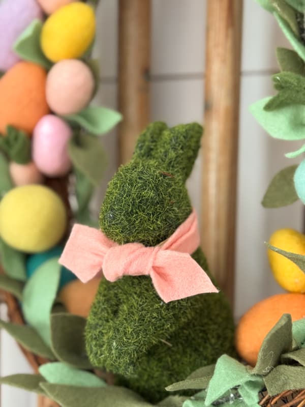 Tie felt bow around the recycled moss bunny for Easter Wreath