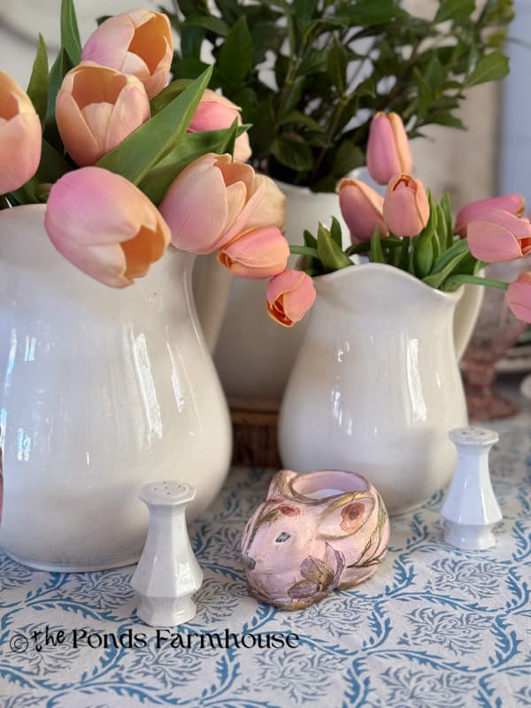 Easter table centerpiece with 3 ironstone pitchers & tulips