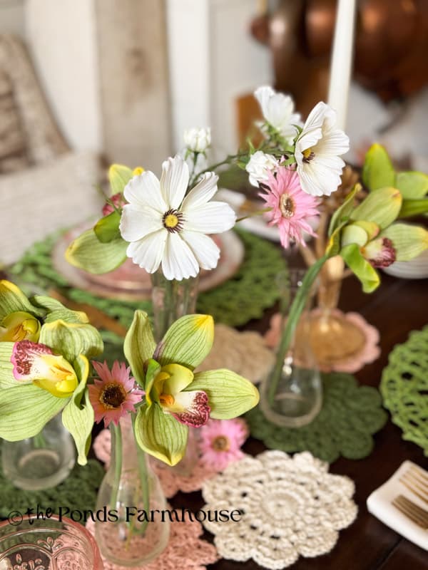 Flowers in clear vases for spring table centerpiece