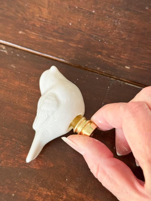 Insert finial into the ceramic bird to test for a good fit