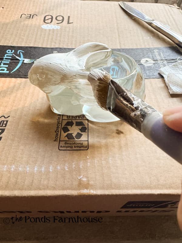 painting the clear glass bunny with white chalk paint