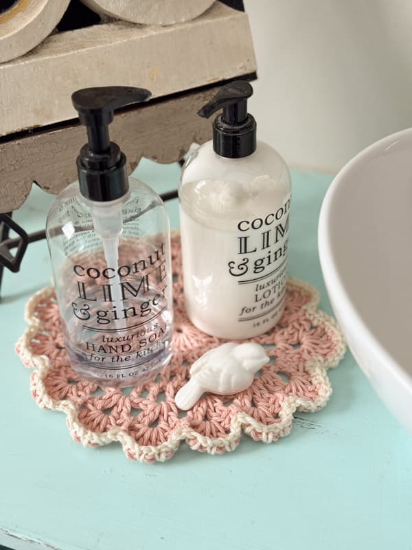 Pink & White Doily under handsoap & lotion in bathroom