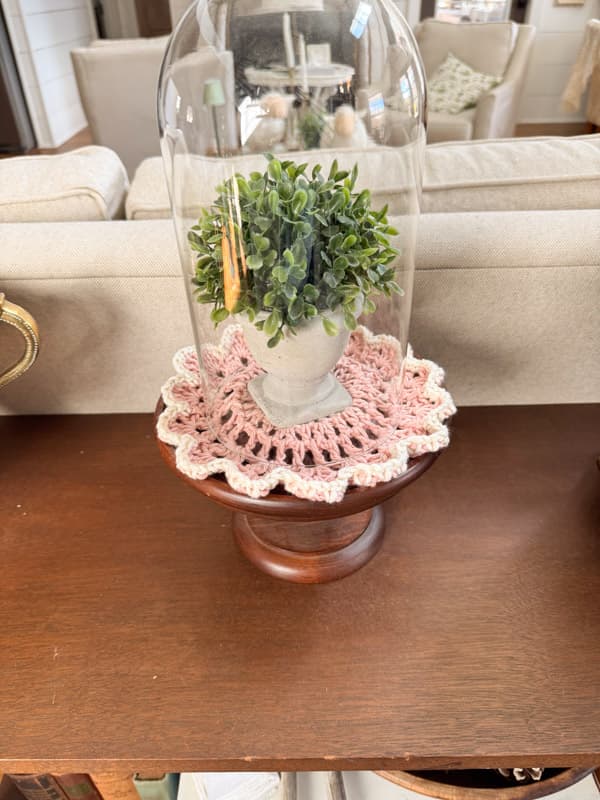 Pink & White Doily under plant in a cloche