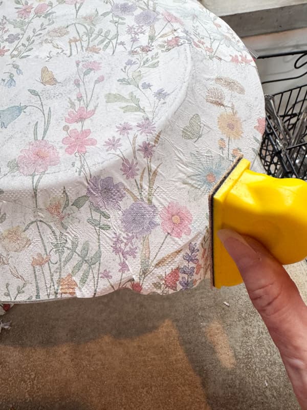 Sand edges of plate to remove excess napkin