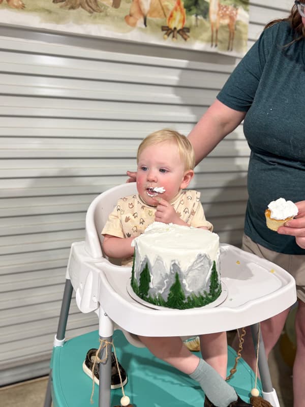 Sawyer's first birthday party - eating cupcake